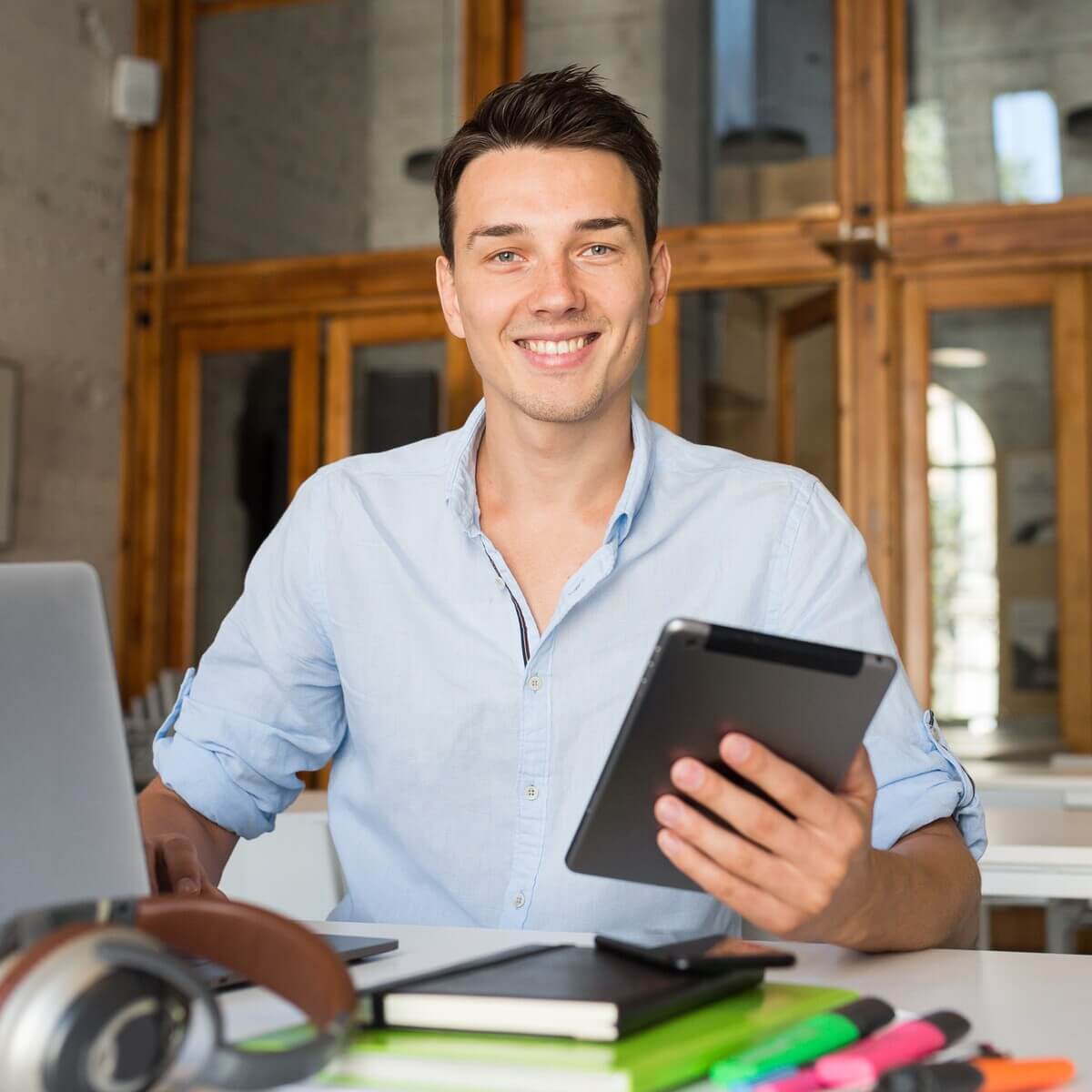 happy young confident man working on laptop 2023 11 27 04 58 31 utc